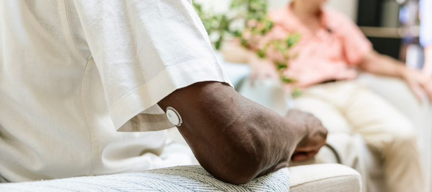 Person wearing low-cost CGM