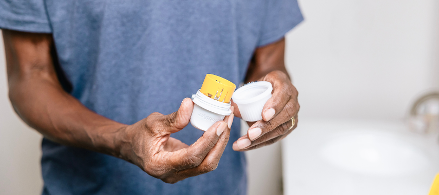 person opening up a CGM to apply