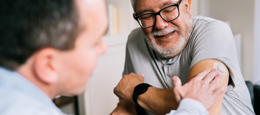 man applying FSA eligible cgm