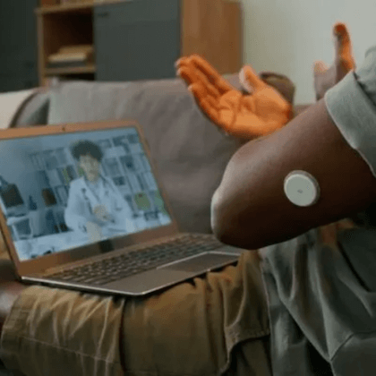 man wearing cgm watching educational video