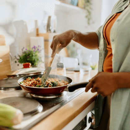 woman cooking medical nutrition therapy meal